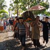 Kisah Pasutri Pedagang Kue Terseret Banjir Bandang Bali