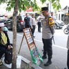 Deteksi Uang Palsu saat Lebaran, Polres Lamongan Sisir Tempat Penukaran Uang Baru