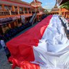 Kemerdekaan RI, Bendera Sepanjang 77 Meter Dikibarkan 1500 Siswa SMK di Ponorogo 